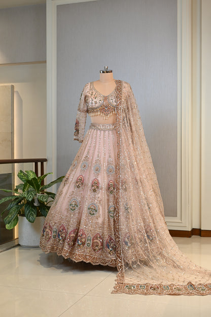Elegant Powder Peach Lehenga Set crafted In Delicate Net