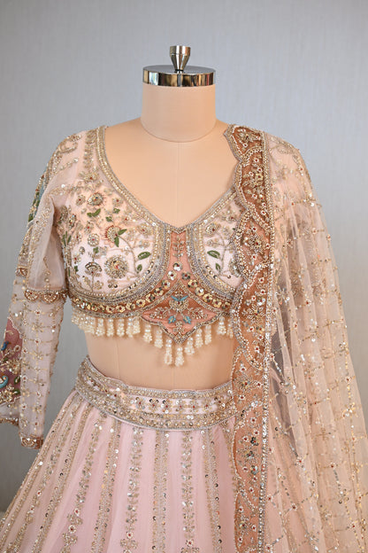 Elegant Powder Peach Lehenga Set crafted In Delicate Net