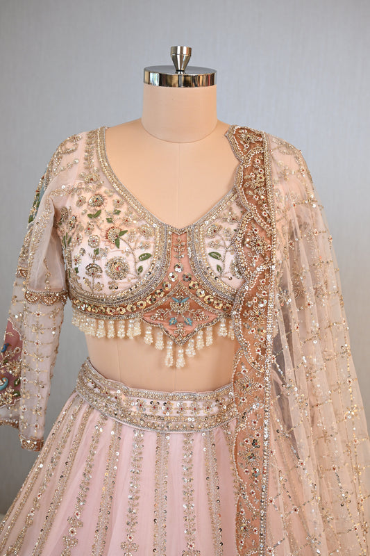 Elegant Powder Peach Lehenga Set crafted In Delicate Net