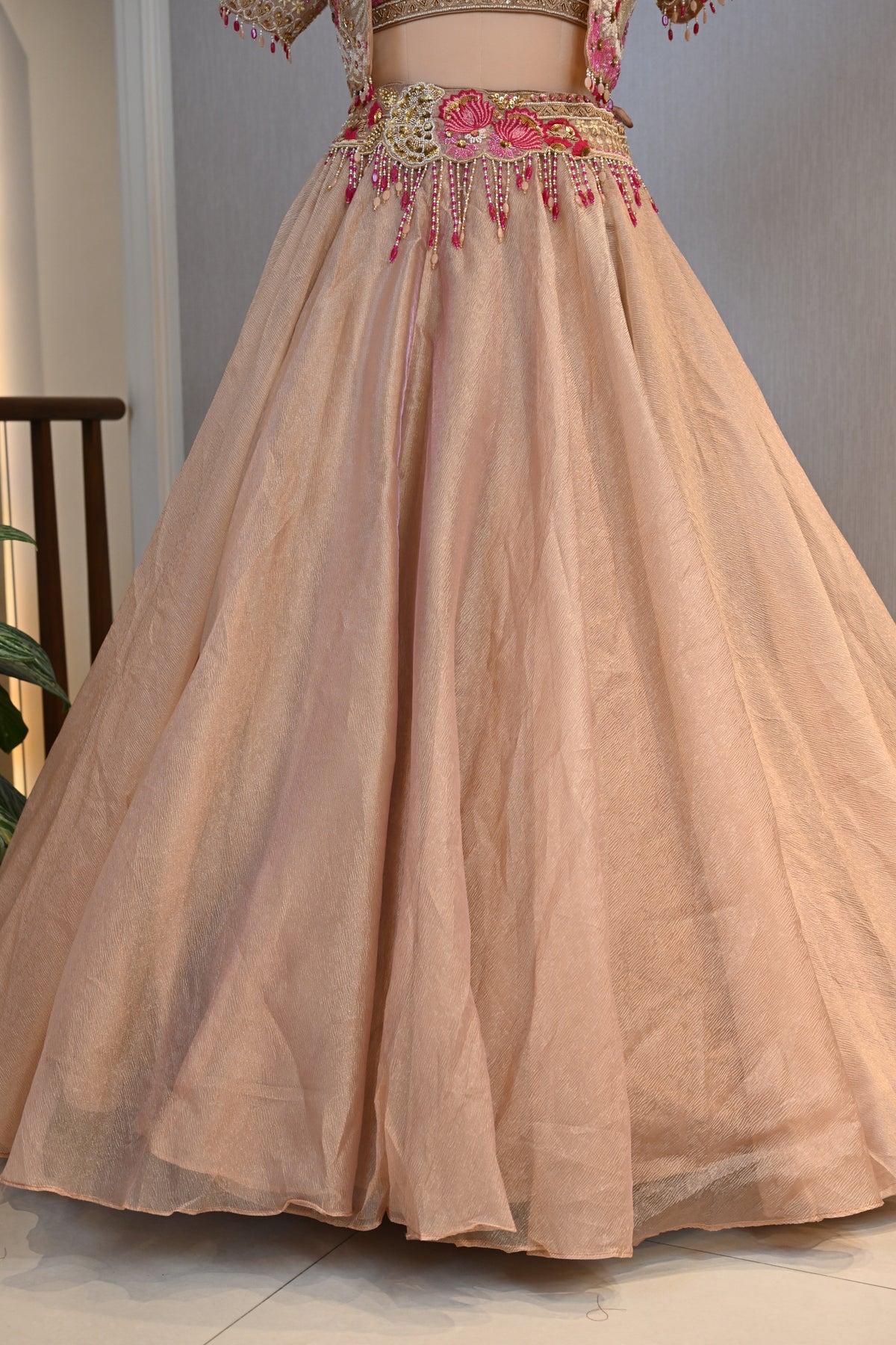 Elegant Powder Peach Tissue Lehenga Choli with Embellished Cape
