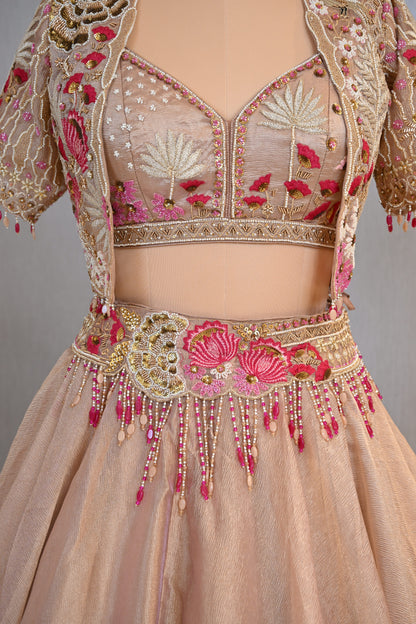 Elegant Powder Peach Tissue Lehenga Choli with Embellished Cape